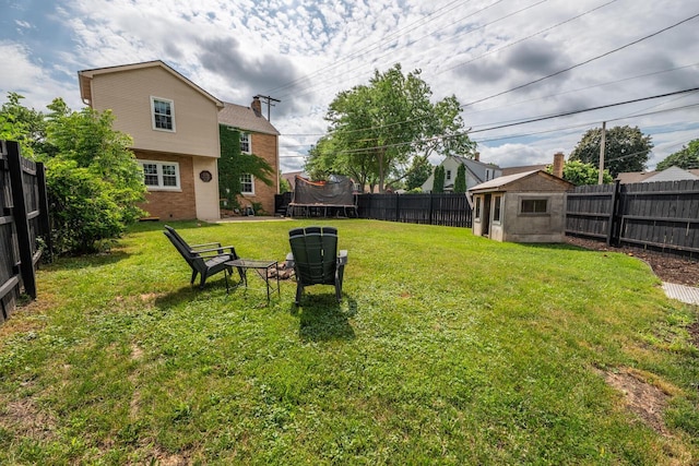 7550 26th Ave, Kenosha, WI 53143 - fenced backyard with a trampoline and a storage unit