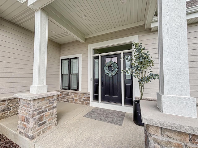 1601 Sauk Trl, Waukesha, WI 53189 - view of exterior entry featuring covered porch and stone siding