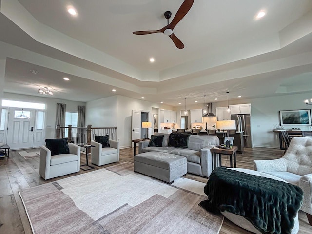 1601 Sauk Trl, Waukesha, WI 53189 - living room featuring a raised ceiling, wood finished floors, ceiling fan, and recessed lighting