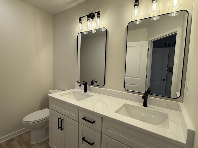 3150 Bartells Dr, Beloit, WI 53511 - bathroom with double vanity and wood finished floors