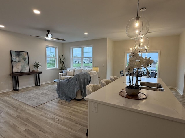 3150 Bartells Dr, Beloit, WI 53511 - living room featuring light wood-style floors, recessed lighting, ceiling fan, and a chandelier