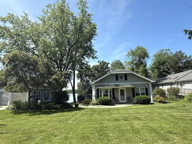 N65W35097 Rd J, Oconomowoc, WI 53066 - view of front of home with a front yard and covered porch