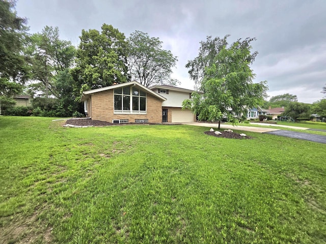 4643 N 108th St, Wauwatosa, WI 53225 - view of front of house with driveway, brick siding, an attached garage, and a front yard