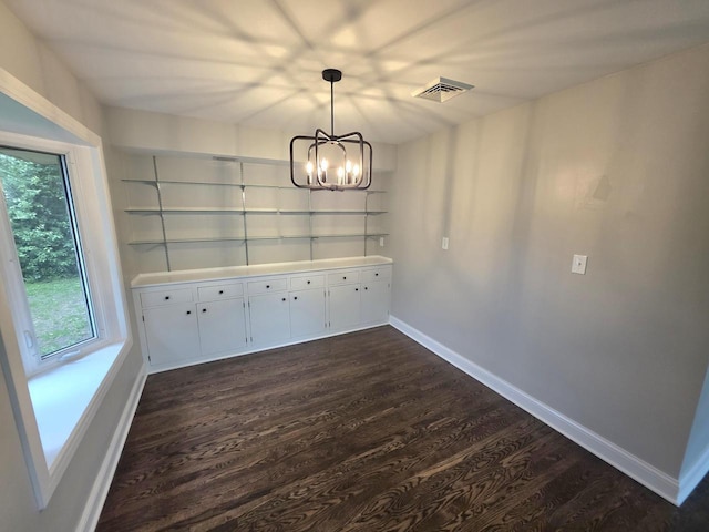4643 N 108th St, Wauwatosa, WI 53225 - unfurnished dining area featuring dark wood-style floors and a chandelier
