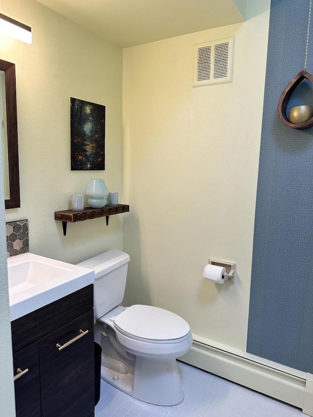 8221 Fairmont Ln, Greendale, WI 53129 - half bath featuring a baseboard heating unit, tile patterned flooring, and vanity