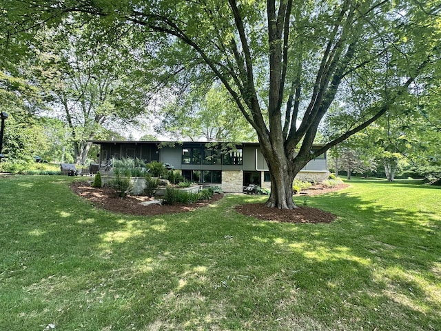 8221 Fairmont Ln, Greendale, WI 53129 - back of property featuring a lawn
