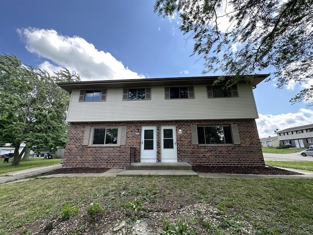 5145 Admiralty Ave Unit 5147, Racine, WI 53406 - colonial-style house featuring brick siding and a front yard