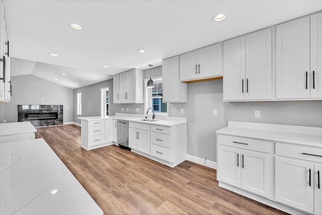 7314 25th Ave, Kenosha, WI 53143 - kitchen featuring dishwasher, open floor plan, light countertops, light wood-style flooring, and recessed lighting