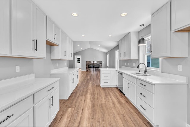 7314 25th Ave, Kenosha, WI 53143 - kitchen with stainless steel dishwasher, light wood-style flooring, recessed lighting, lofted ceiling, and open floor plan