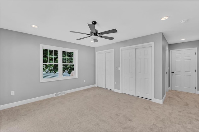 7314 25th Ave, Kenosha, WI 53143 - unfurnished bedroom with two closets, carpet flooring, recessed lighting, and ceiling fan