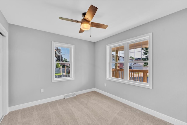 7314 25th Ave, Kenosha, WI 53143 - empty room with carpet floors and a ceiling fan