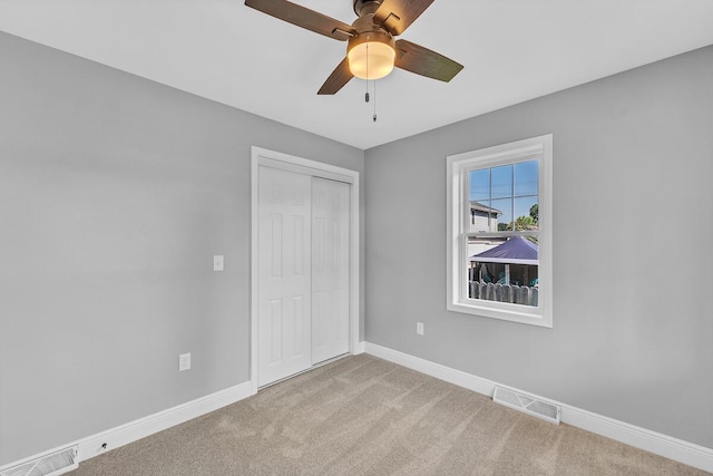 7314 25th Ave, Kenosha, WI 53143 - unfurnished bedroom featuring carpet floors, a closet, and ceiling fan