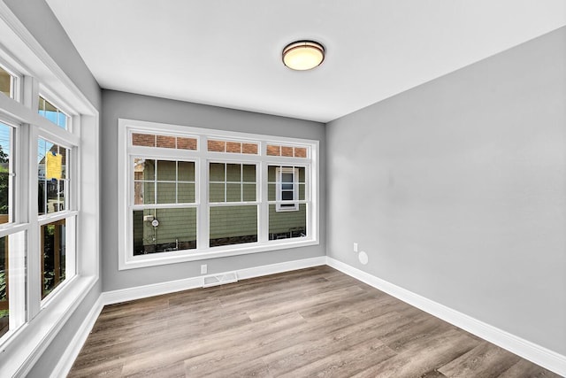 7314 25th Ave, Kenosha, WI 53143 - empty room featuring baseboards and wood finished floors