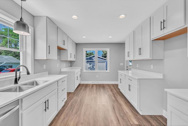 7314 25th Ave, Kenosha, WI 53143 - kitchen featuring dishwasher, light wood-type flooring, healthy amount of natural light, and recessed lighting