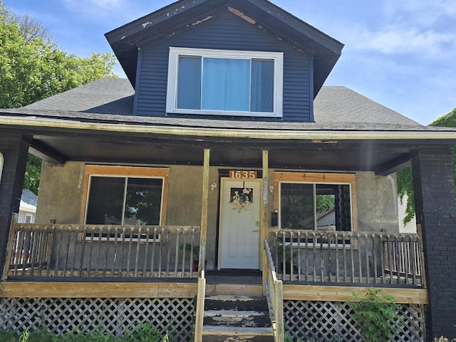 1635 Grand Ave, Racine, WI 53403 - view of front facade with a porch and roof with shingles