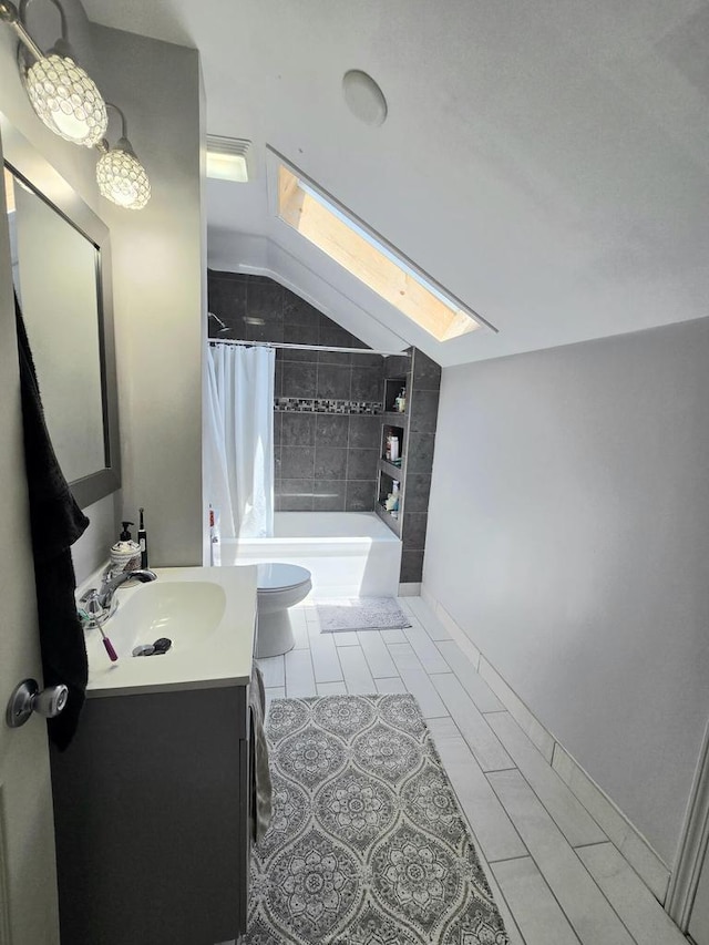 1635 Grand Ave, Racine, WI 53403 - bathroom with a skylight, lofted ceiling, vanity, shower / bath combo, and tile patterned flooring