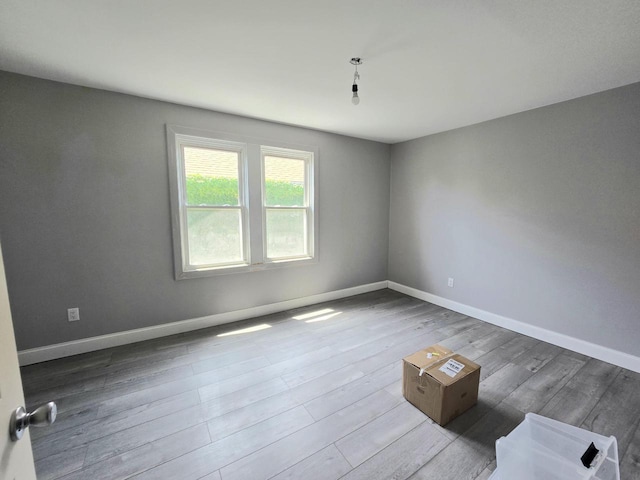 1635 Grand Ave, Racine, WI 53403 - empty room featuring wood finished floors and baseboards