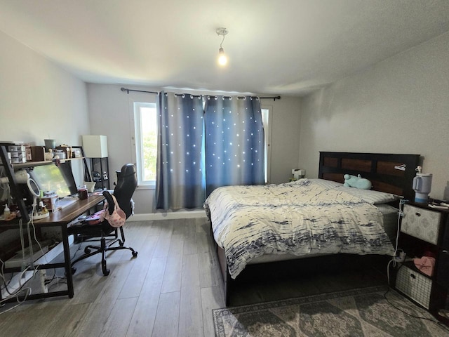 1635 Grand Ave, Racine, WI 53403 - bedroom featuring wood finished floors and an office area