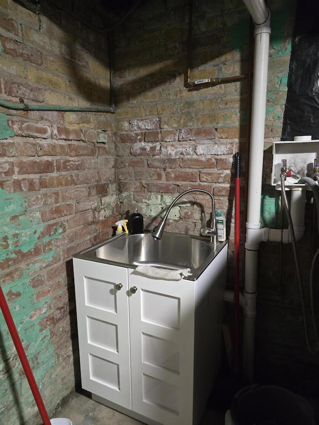 1635 Grand Ave, Racine, WI 53403 - interior space with brick wall and white cabinets