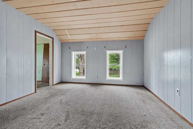 951 Oak St, Wisconsin Rapids, WI 54494 - empty room featuring carpet floors, wooden walls, and wood ceiling