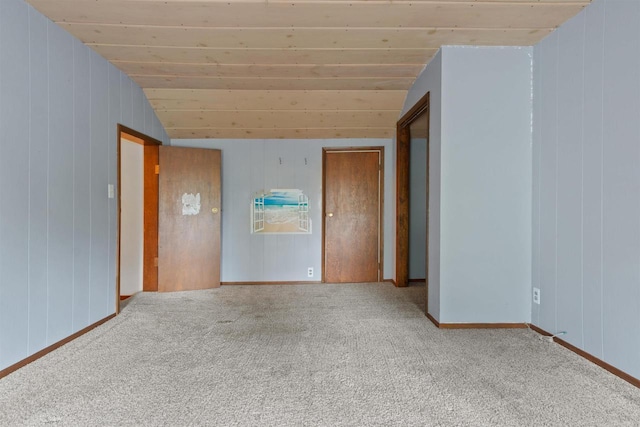 951 Oak St, Wisconsin Rapids, WI 54494 - carpeted spare room featuring lofted ceiling, wooden walls, and wood ceiling