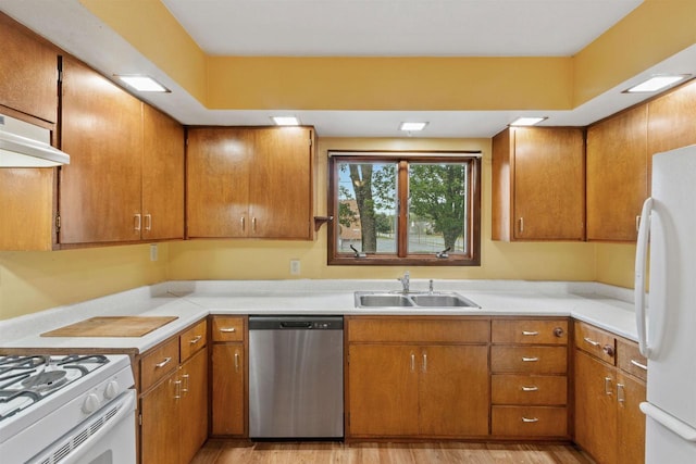 951 Oak St, Wisconsin Rapids, WI 54494 - kitchen with stainless steel dishwasher, freestanding refrigerator, light countertops, and light wood finished floors