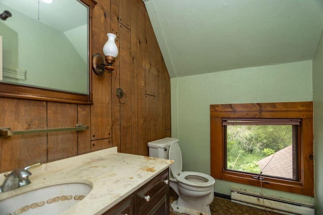 5046 State Highway 33, West Bend, WI 53095 - half bathroom with vaulted ceiling, a baseboard radiator, and vanity