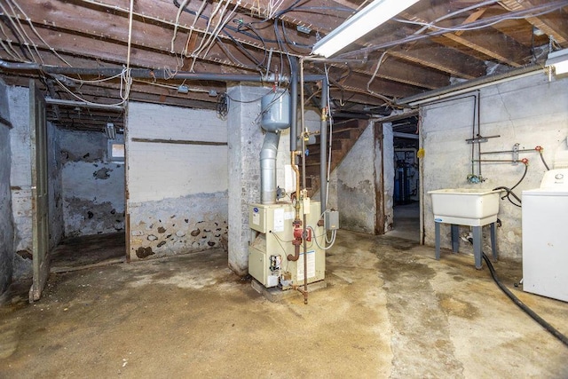 5046 State Highway 33, West Bend, WI 53095 - unfinished basement featuring washer / dryer and a sink