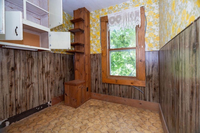 5046 State Highway 33, West Bend, WI 53095 - interior space featuring wallpapered walls and wood walls