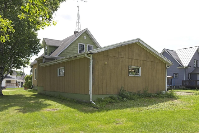 134 N Watertown St, Waupun, WI 53963 - view of property exterior featuring a lawn