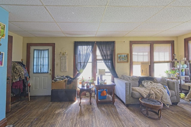 134 N Watertown St, Waupun, WI 53963 - living room featuring a drop ceiling and hardwood / wood-style flooring