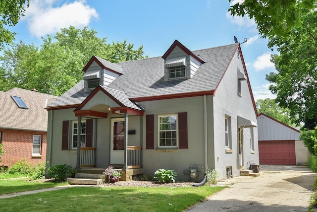2044 S 96th St, West Allis, WI 53227 - view of front of house featuring stucco siding, a shingled roof, a garage, and an outbuilding
