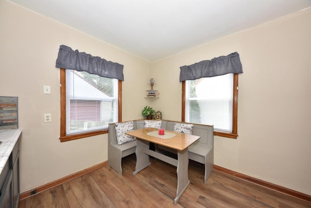 2044 S 96th St, West Allis, WI 53227 - dining room featuring light wood-style floors and baseboards