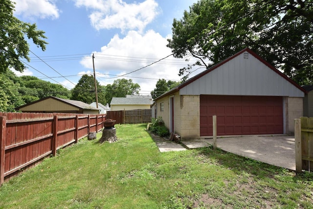 2044 S 96th St, West Allis, WI 53227 - view of yard featuring a detached garage and an outdoor structure
