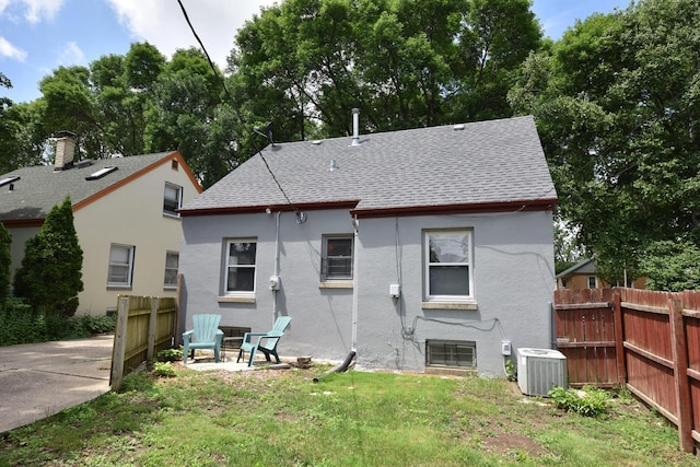 2044 S 96th St, West Allis, WI 53227 - rear view of property featuring a shingled roof and stucco siding