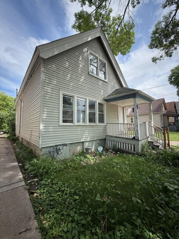 2564 N 17th St, Milwaukee, WI 53206 - rear view of property with covered porch