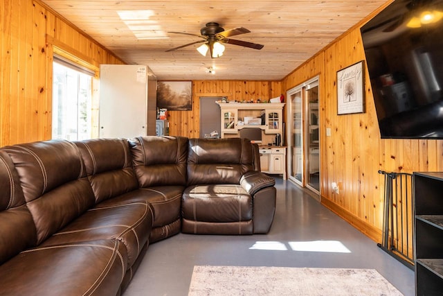 E2880 Witcraft Ridge Rd, Genoa, WI 54632 - living area with wood walls, ceiling fan, wood ceiling, and concrete floors