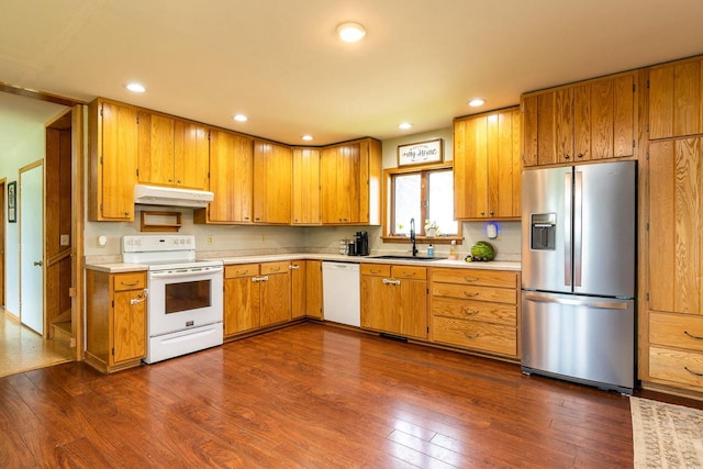 E2880 Witcraft Ridge Rd, Genoa, WI 54632 - kitchen featuring white appliances, under cabinet range hood, light countertops, dark wood-style flooring, and recessed lighting