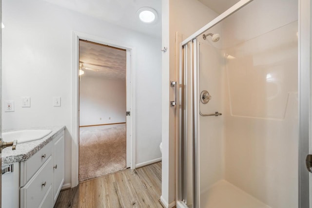 2232 N Cloudview Dr, Appleton, WI 54914 - full bath with a stall shower, wood finished floors, and vanity