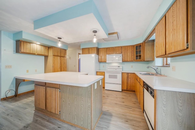 2232 N Cloudview Dr, Appleton, WI 54914 - kitchen with white appliances, light wood-style floors, light countertops, and brown cabinetry