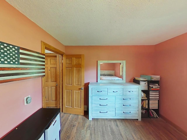 6410 Lenox Ave, Wisconsin Rapids, WI 54494 - office area featuring wood finished floors and a textured ceiling