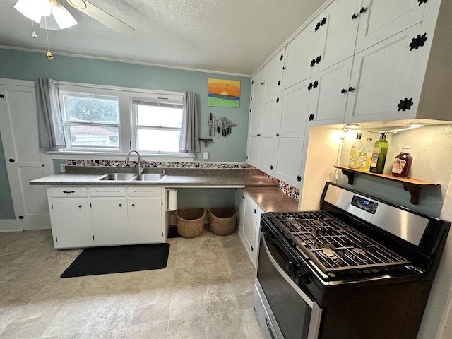 110 Bowen St, Oshkosh, WI 54901 - kitchen featuring gas stove, white cabinetry, ornamental molding, a ceiling fan, and a textured ceiling