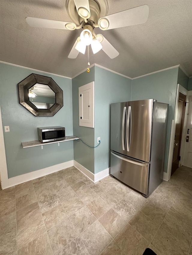110 Bowen St, Oshkosh, WI 54901 - kitchen featuring appliances with stainless steel finishes, ceiling fan, and ornamental molding