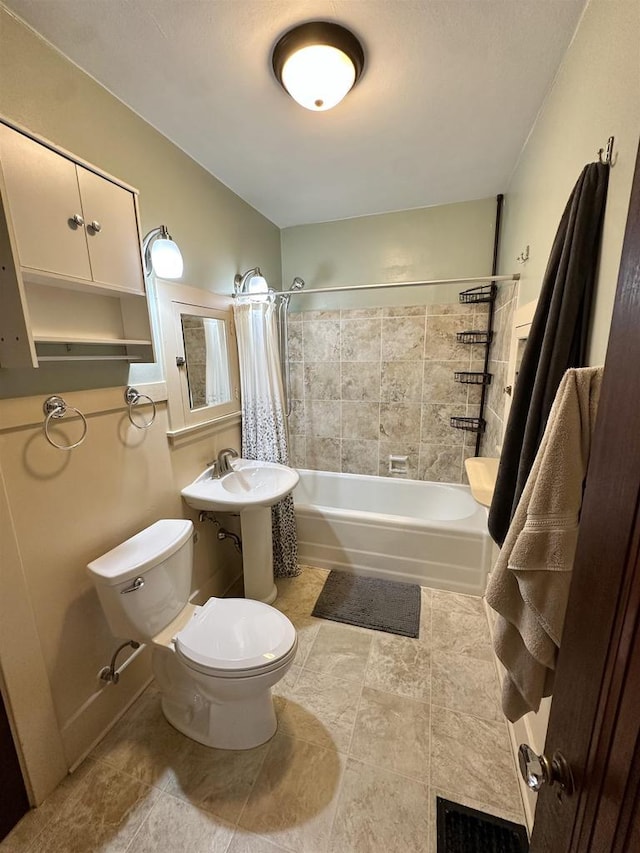 110 Bowen St, Oshkosh, WI 54901 - bathroom with shower / bath combo with shower curtain and tile patterned flooring