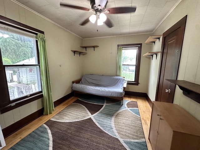 110 Bowen St, Oshkosh, WI 54901 - bedroom with light wood-style floors, ornamental molding, and ceiling fan