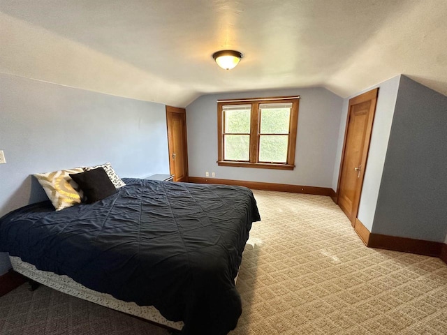 110 Bowen St, Oshkosh, WI 54901 - bedroom featuring vaulted ceiling and light colored carpet