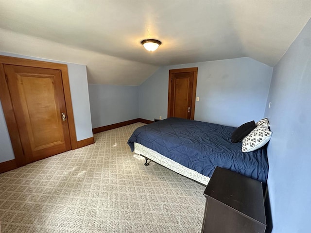 110 Bowen St, Oshkosh, WI 54901 - bedroom featuring vaulted ceiling and light colored carpet