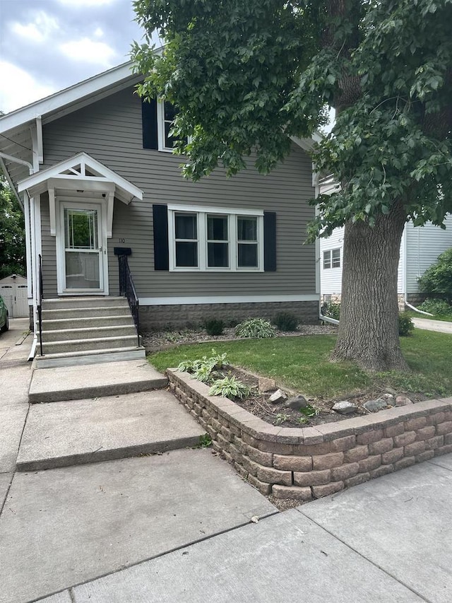 110 Bowen St, Oshkosh, WI 54901 - view of front of home with a front yard