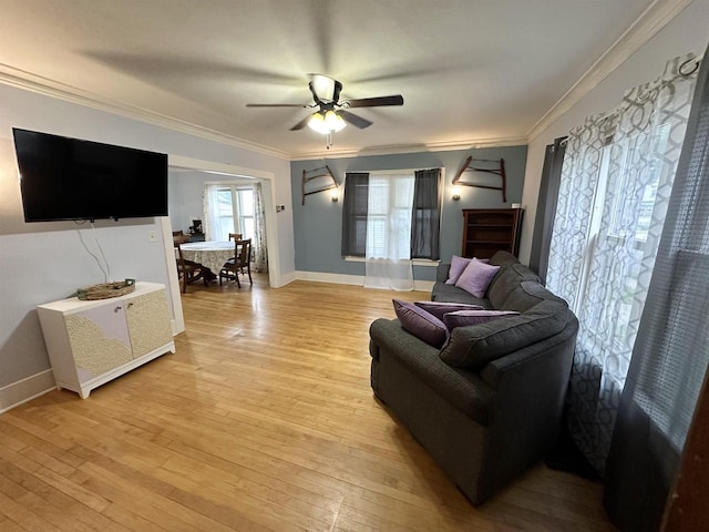 110 Bowen St, Oshkosh, WI 54901 - living room with crown molding, light wood-type flooring, and a ceiling fan