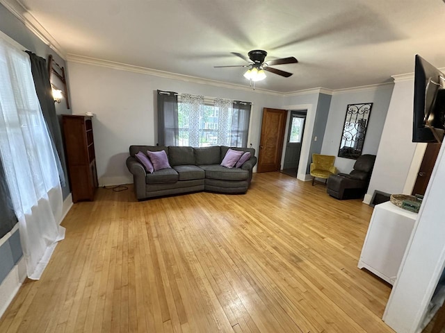 110 Bowen St, Oshkosh, WI 54901 - living area with light wood finished floors, a ceiling fan, and crown molding